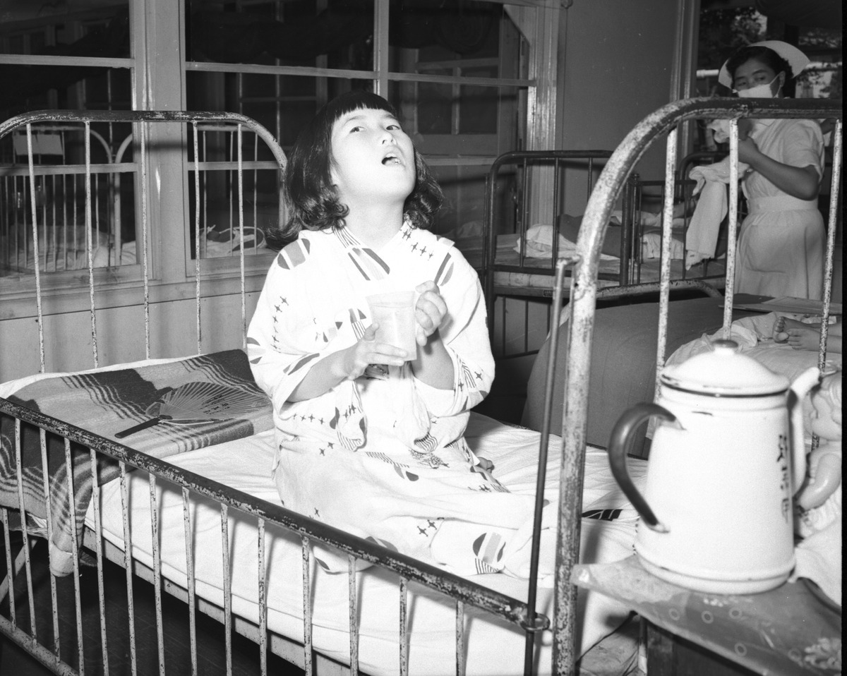 A Young Girl Stricken with Influenza, Japan, 1957