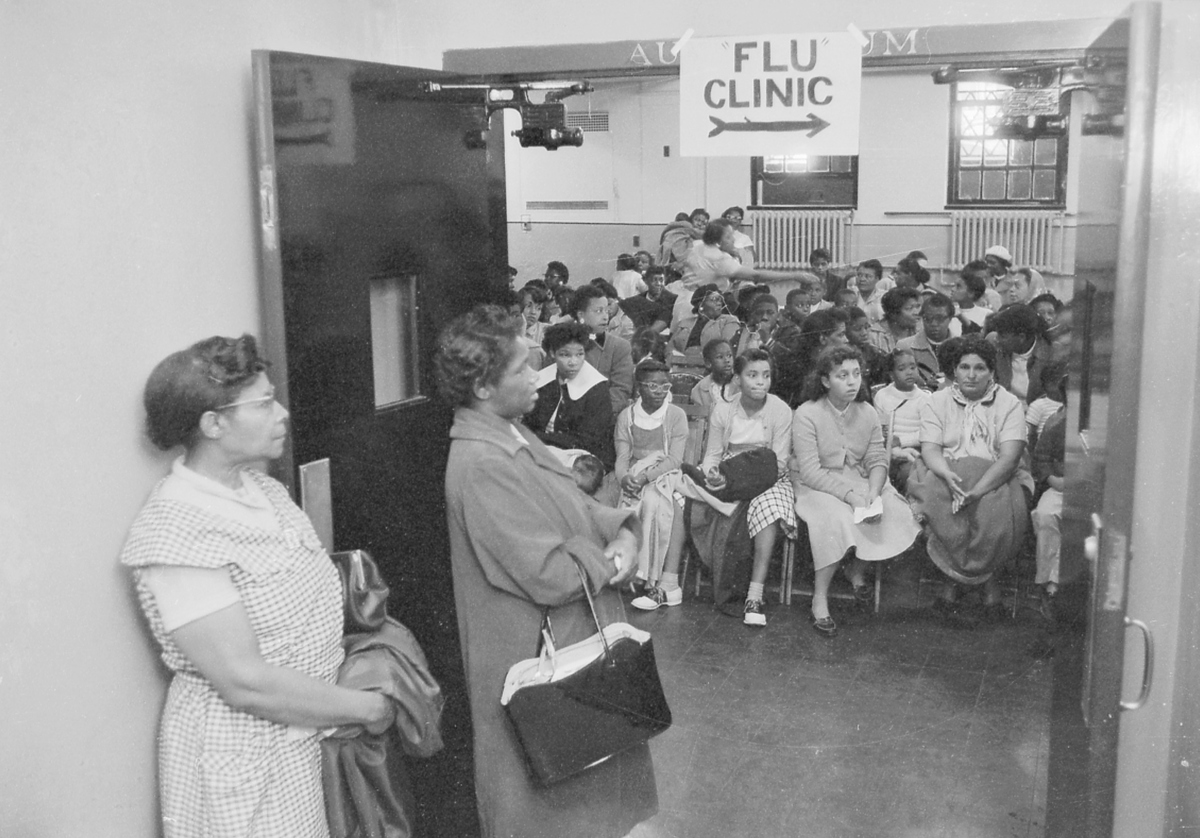 People at a flu clinic in Harlem, New York, 1957